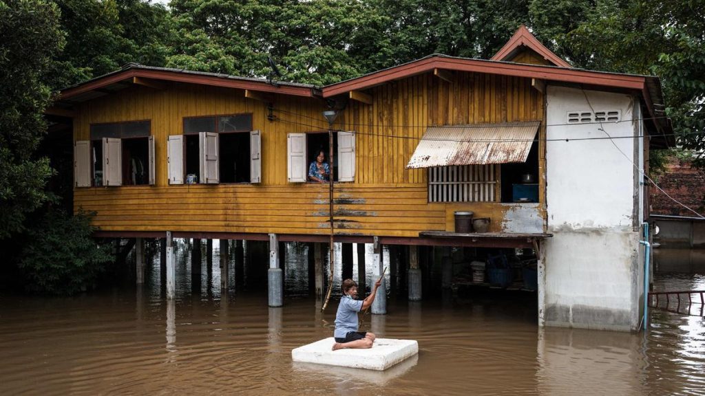 Stilt houses in villages north of Bangkok are no longer high enough to stay dry as Thai